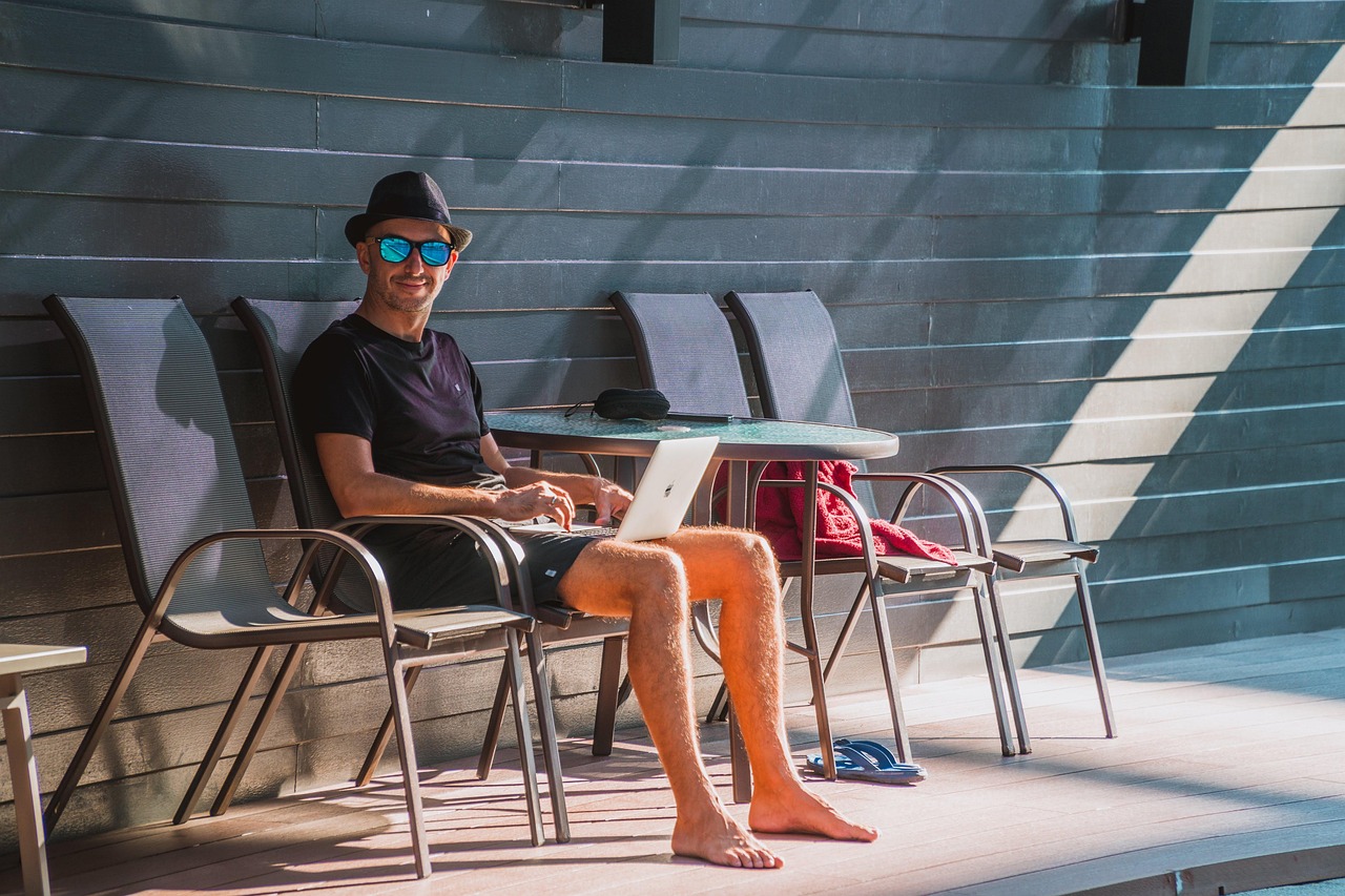 Man, laptop, work — Guaranteed Approval: Your Guide to Everyone Approved Loans
