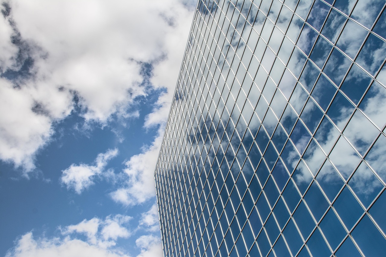 Building, reflection, clouds — How to Use MetaTrader 4 on MAC OS for Desktop Trading